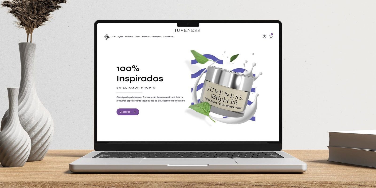 Laptop con la portada de la tienda: «100% inspirados»